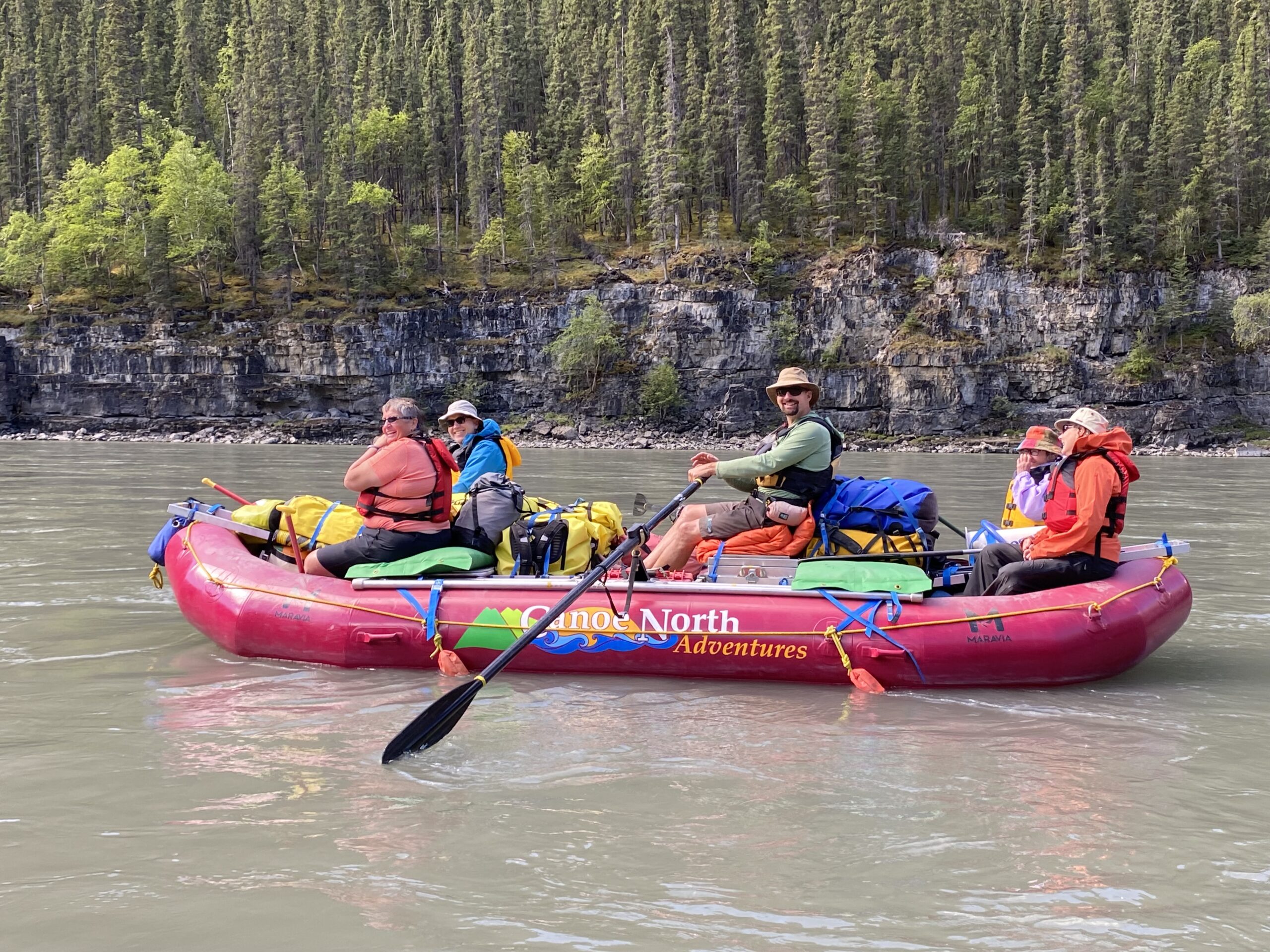 A group of people on a raft on the Nahanni River